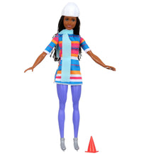 Ice skating fashion doll wearing blue striped dress, blue leggings, and white hat