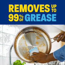 Greasy pan being washed with foamy suds and soapy water from liquid dish soap