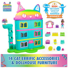 Celebration dollhouse with cat-shaped pink roof, teal doors, and accessory playset pieces