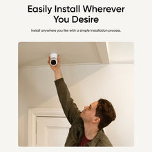Wired indoor security camera mounted under a ceiling