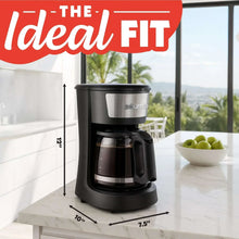 Black 12-cup coffee maker on counter with carafe and lid closed