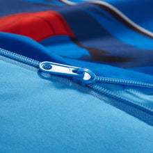 Blue fabric slumber bag with plastic zipper and pull tab