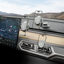 Magnetic phone mount with dash and vent-style bases, holding phone in car