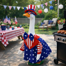 Goose statue wearing an American flag cape with red, white, and blue details.