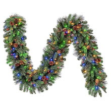 Pre-lit artificial greenery garland loop with pine-like tips and multicolor lights