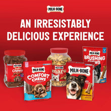 Assorted Milk-Bone dog treat packages, including peanut butter dipped biscuits