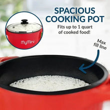 Red multi-cooker pot interior with bubbling contents and fill line