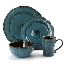 Teal-blue ceramic dinnerware set close-up: round plates, cereal bowl, and mug with speckles