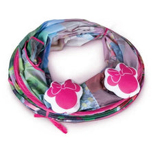 Play tunnel interior with multicolor fabric lining and pink bow headrest cushions