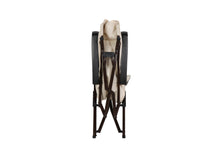 High back reclining lounge chair rear view in cream with black frame and adjustable armrests