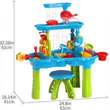 Kids dinosaur sand and water table with blue top, red dolphin figure, and green legs