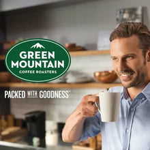 Green Mountain Breakfast Blend Keurig logo and mug held by person