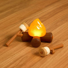 Light-up campfire toy with orange flame and brown log pieces