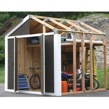 White and wood shed framing kit with open doorway and exposed vertical studs