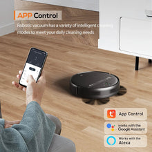 Black robotic vacuum with app-controlled smartphone and remote control nearby