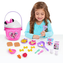 Pink Minnie Mouse bucket with heart graphic, surrounded by pretend food pieces and utensils