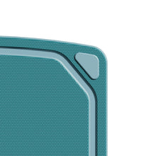 Close-up of blue non-slip cutting board corner grip and textured surface