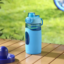 Blue Tritan water bottle with flip-top lid and silicone sleeve, no straw
