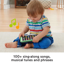 Toddler holding learning tablet with colorful app-style buttons