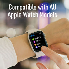 White magnetic watch charger cable charging an Apple Watch on wrist