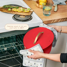 Red electric multi-cooker with open lid and removable inner pot