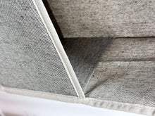 Gray fabric organizer panel with reinforced seam detail