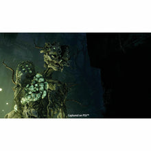 Returnal PS5 game art of a green-glowing monstrous alien creature