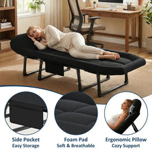 Black folding camping cot with padded foam pad and ergonomic pillow, side storage pocket panel