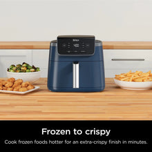 Navy air fryer on kitchen counter with digital display and dual pull handle