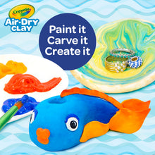 Air-dry clay fish figure with painted-style orange and blue details