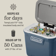 Blue hard cooler chest with lid open, bottles and cans on white interior.