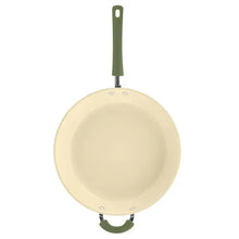Ceramic nonstick frying pan with long green handle and cream interior coating