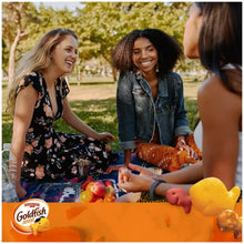 Goldfish snack packs on a picnic table with visible cracker bag front labels