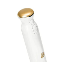 Cordless immersion blender in white casing with gold top and oval control buttons