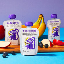 Bettergoods yogurt & oats fruit pouches with purple caps in front of fruit