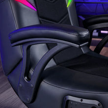 Black gaming chair armrest and side panel with textured mesh back