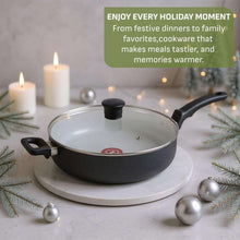 Black jumbo sauté pan with clear glass lid and two side handles