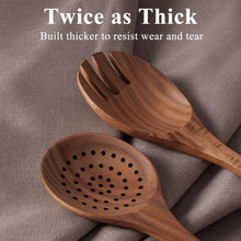 Wooden slotted spoon and solid spoon, perforated bowl for draining.