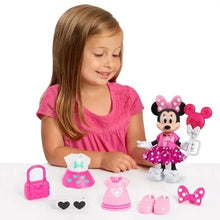 Minnie-style fashion doll with pink accessories, including dress, shoes, and bow