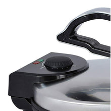 Electric tortilla press with black temperature control knob on stainless steel lid