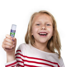 Clear glue stick held in hand, small white tube with purple label