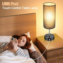 Table lamp with fabric shade and touch control base, USB port on the side.