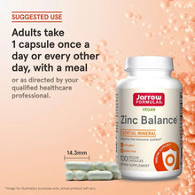 Vegan zinc supplement bottle with instructions panel and mint-green capsules