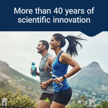 Running couple holding supplement bottles with the message “More than 40 years of…”