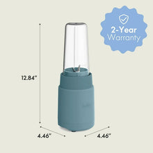 Portable rocket blender with teal base and clear blending cup, compact size