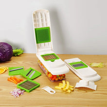 Multi-function mandoline slicer with hinged storage tray, white base, green grater plate
