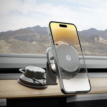Magnetic car phone mount with MagSafe-compatible ring, holding phone on dashboard