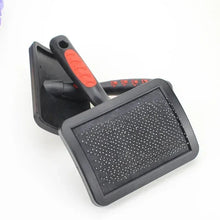 Slicker grooming brush with large rectangular bristle pad and red-speck grip