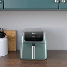 Sage air fryer on countertop, front display showing 400 and pull-out handle.