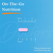 Pink veggie capsule on blue size guide with 0 cm and 0 inch marks